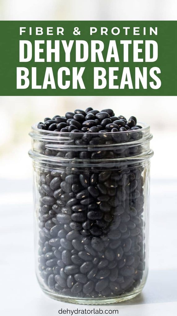 A jar of dehydrated cooked black beans on a pantry shelf